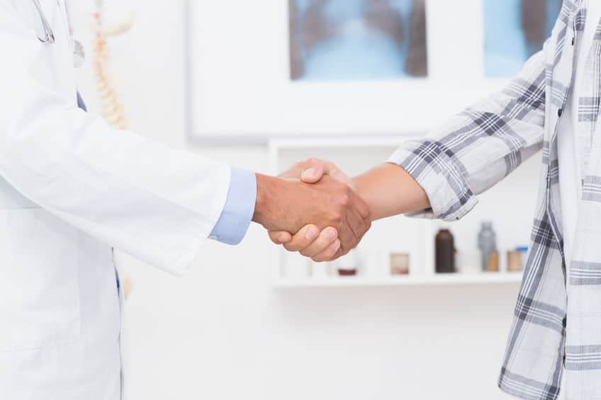 doctor and patient shaking hands