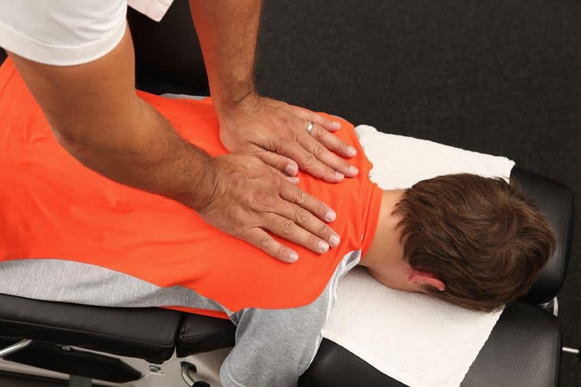 chiroprator with patient