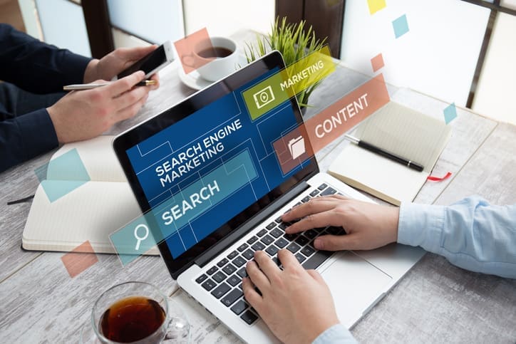 SEARCH ENGINE MARKETING CONCEPT - Local SEO and Search Engine Marketing | FMS Online Marketing man using laptop for business
